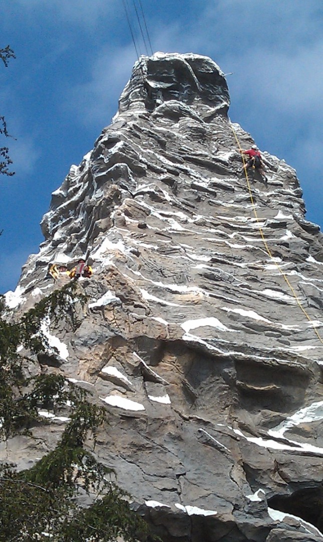 Happy Hans and his son entertain while the climbers are out.