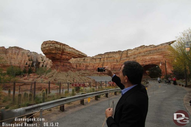 Bob Iger taking a picture of Radiator Springs Racers