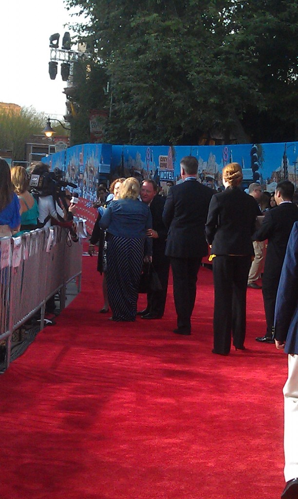John Lasseter slowly making his way down the red carpet.