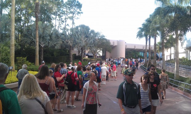 The line for #Epcot30 merchandise stretches past Spaceship Earth
