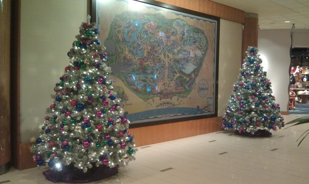 Two trees flank the Disneyland map in the Fantasy Tower lobby.