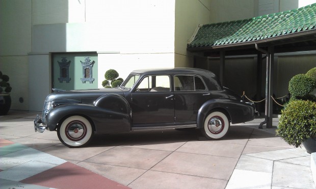 An old Cadillac out front of the Chinese Theater