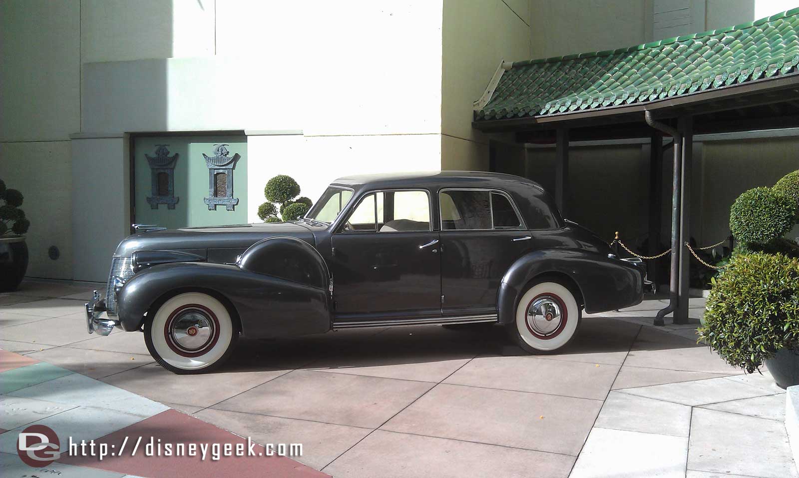An old Cadillac out front of the Chinese Theater