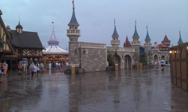 Venturing out since the rain seems a steady, light drzzle.  Walking through Fantasyland