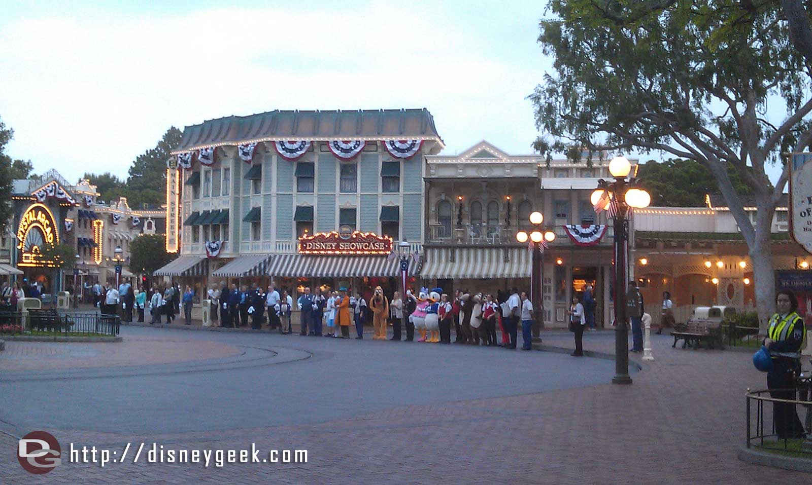 A receiving line of characters and cast members on Main Street USA JustGotHappier