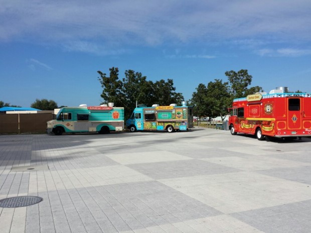 Four food trucks at the far end of the West Side