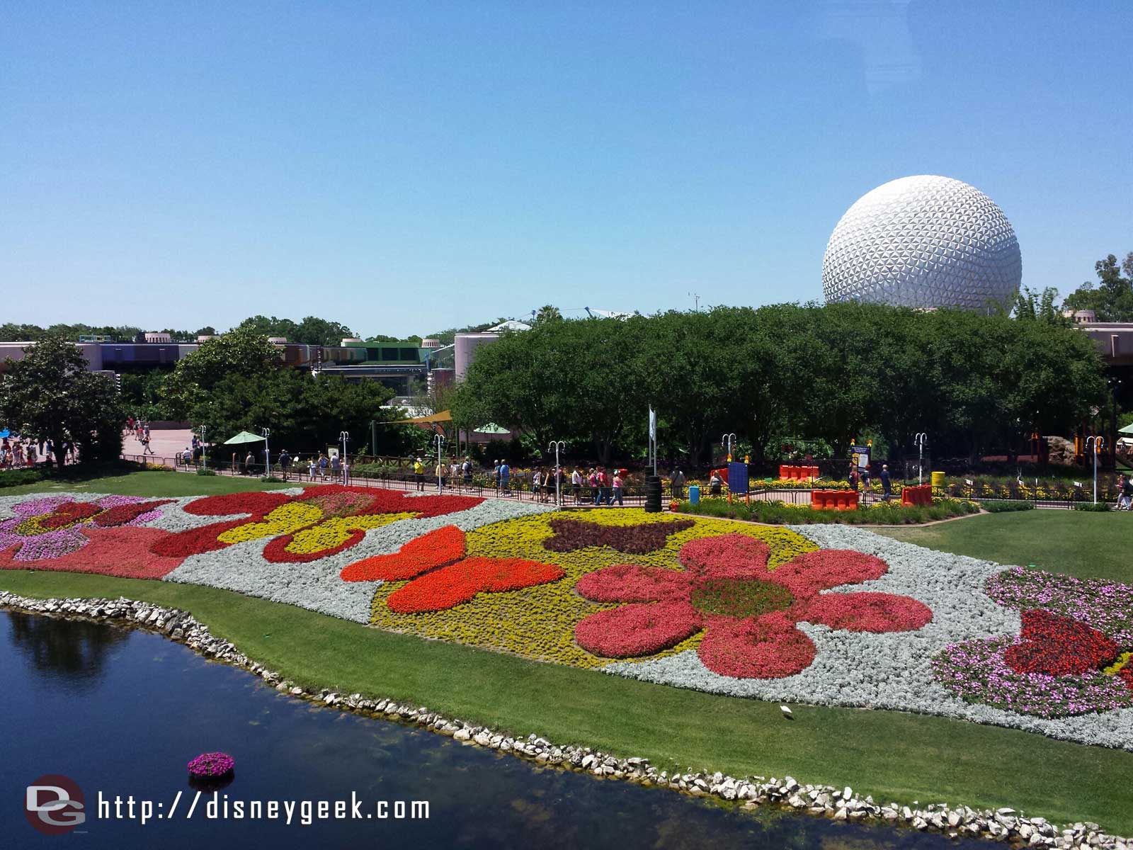 The view from onboard the Monorail of the flower beds with Spaceship Earth in the background - Epcot International Flower & Garden Festival