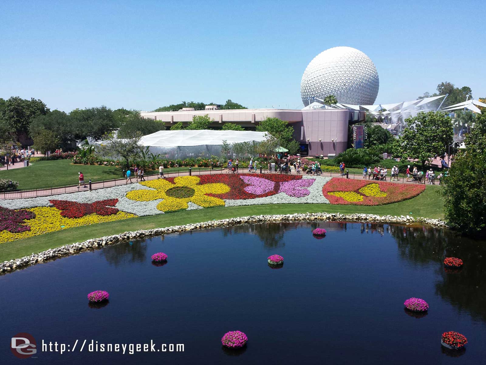 The view from onboard the Monorail of the flower beds with Spaceship Earth in the background - Epcot International Flower & Garden Festival
