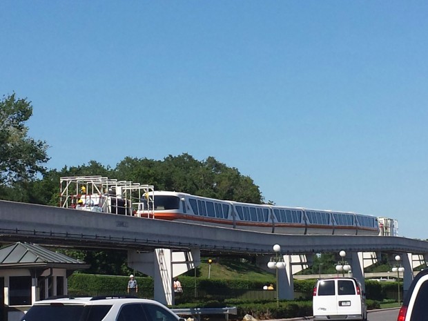 Monorail Orange slowly being towed/pushed backstage.