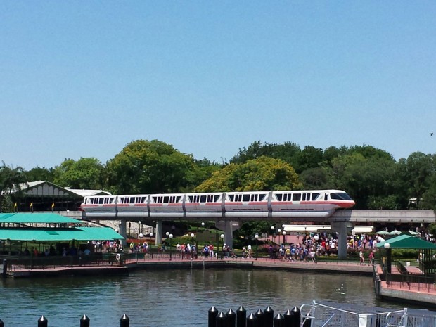 A monorail pulling out of the Magic Kingdom station.