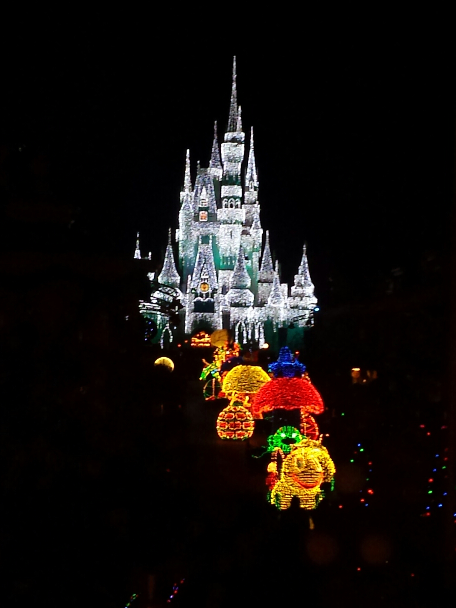 The Main Street Electrical Parade working its way up Main Street toward Cinderella Castle.