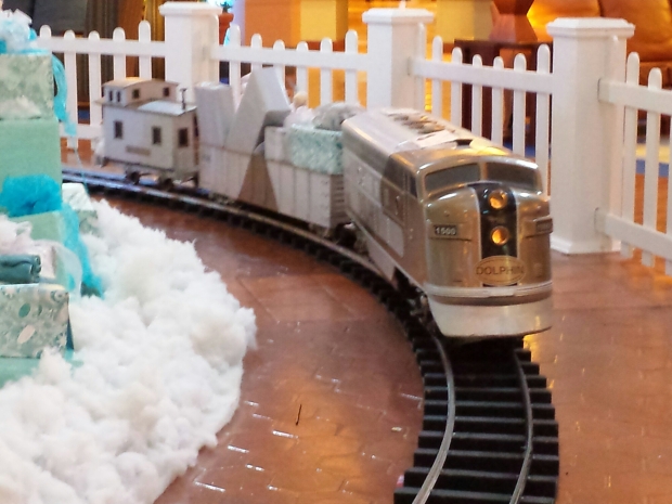 A train around the the tree in the Dolphin hotel.