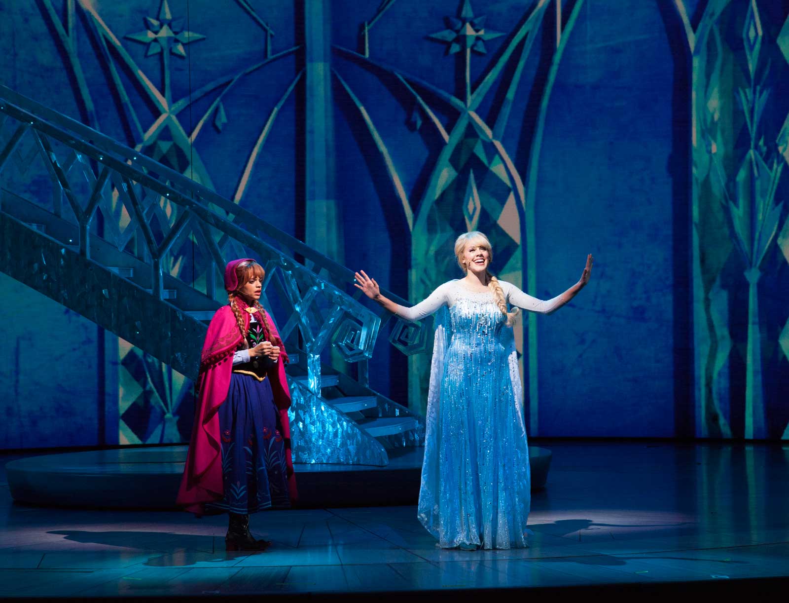 ANNA AND ELSA IN 'FROZEN - LIVE AT THE HYPERION' -- A new theatrical interpretation for the stage based on Disney's animated blockbuster film, Frozen is now playing at the Hyperion Theater at Disney California Adventure Park. The show immerses audiences in the emotional journey of Anna and Elsa with all of the excitement of live theater, including elaborate costumes and sets, stunning special effects and show-stopping production numbers. (Scott Brinegar/Disneyland Resort)