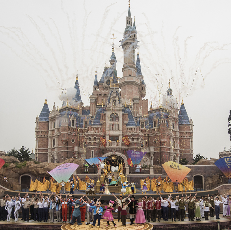 SHANGHAI (June 16, 2016) – Thousands of invited guests celebrated the Grand Opening of Shanghai Disney Resort today with the help of a flood of Shanghai Disney cast members and Disney character friends. Bob Iger, chairman and CEO of The Walt Disney Company joined Chinese CPC Politburo members Wang Yang, State Council Vice Premier, and Han Zheng, Party Secretary of Shanghai, to officially open the resort’s new theme park, Shanghai Disneyland, at the iconic Enchanted Storybook Castle. At the dedication ceremony, six performers wearing enormous, colorful flags represented the six lands of Shanghai Disneyland: Adventure Isle, Gardens of Imagination, Fantasyland, Mickey Avenue, Tomorrowland and Treasure Cove. Shanghai Disney Resort is a world-class family entertainment destination, imagined and created especially for the people of China. The resort consists of Shanghai Disneyland, a theme park with magical experiences for guests of all ages; two richly themed hotels; Disneytown, an international shopping, dining and entertainment district; and Wishing Star Park, a recreational area with peaceful gardens and a glittering lake. Shanghai Disney Resort is a joint venture between The Walt Disney Company and Shanghai Shendi Group comprised of two owner companies (Shanghai International Theme Park Company Limited and Shanghai International Theme Park Associated Facilities Company Limited) and a management company (Shanghai International Theme Park and Resort Management Company Limited). (Todd Anderson, photographer)