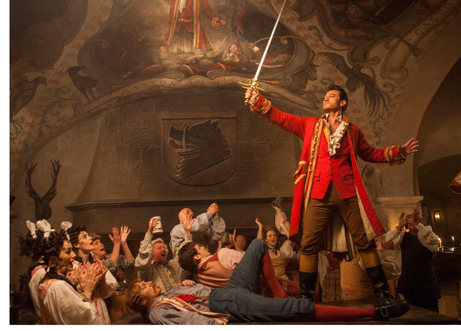 Gaston (Luke Evans) a handsome but arrogant brute, holds court in the village tavern in Disney's BEAUTY AND THE BEAST, directed by Bill Condon, a live-action adaptation of the studio's animated classic and a celebration of one of the most beloved stories ever told.