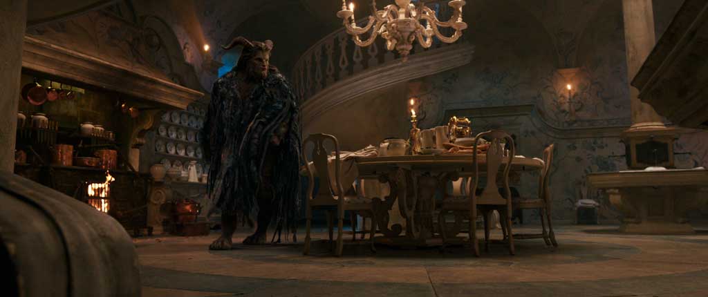 The Beast (Dan Stevens) with Lumiere the candelabra and Cogsworth the mantel clock in the castle kitchen in Disney's BEAUTY AND THE BEAST, a live-action adaptation of the studio's animated classic which is a celebration of one of the most beloved stories ever told.