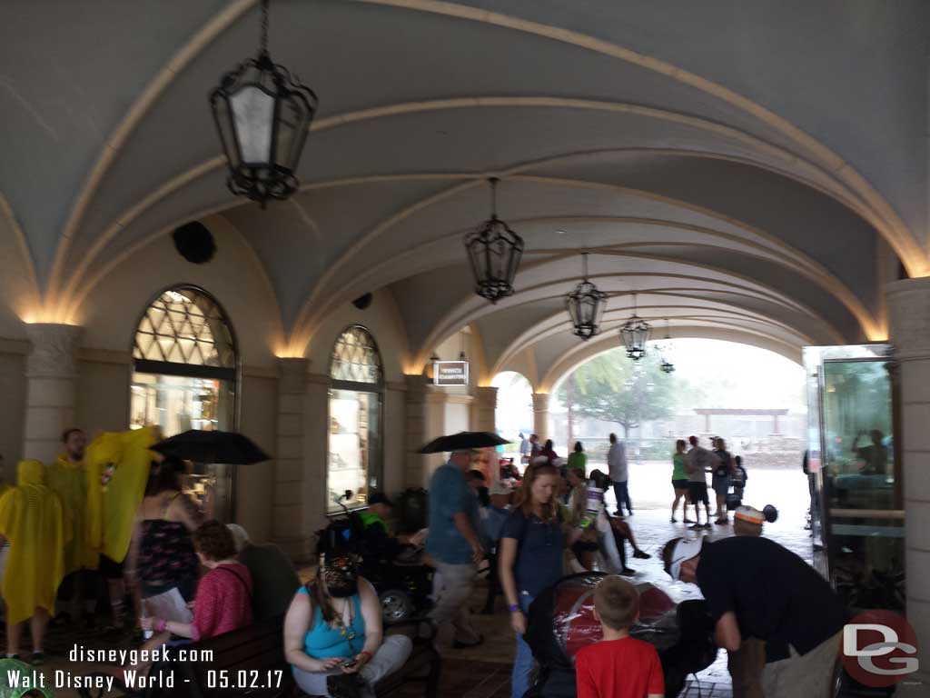 Guests in a breezeway trying to stay dry.