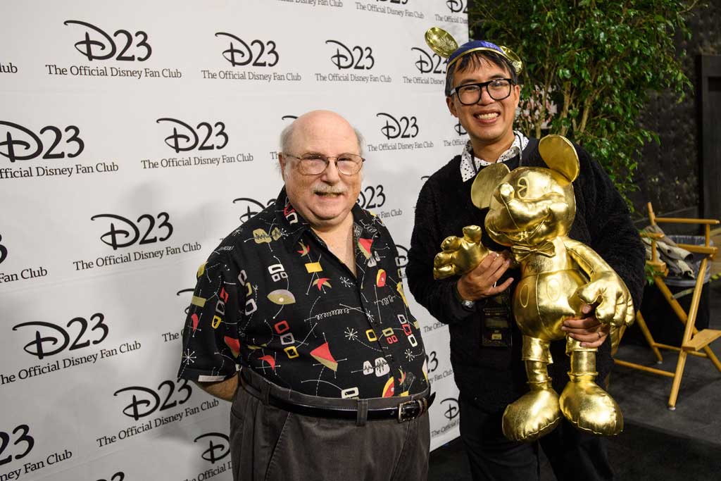 Master Disney Animator Eric Goldberg poses with a guestat D23’s 10-Year FAN-niversary Celebration at the Walt Disney Studios, March 10, 2019.