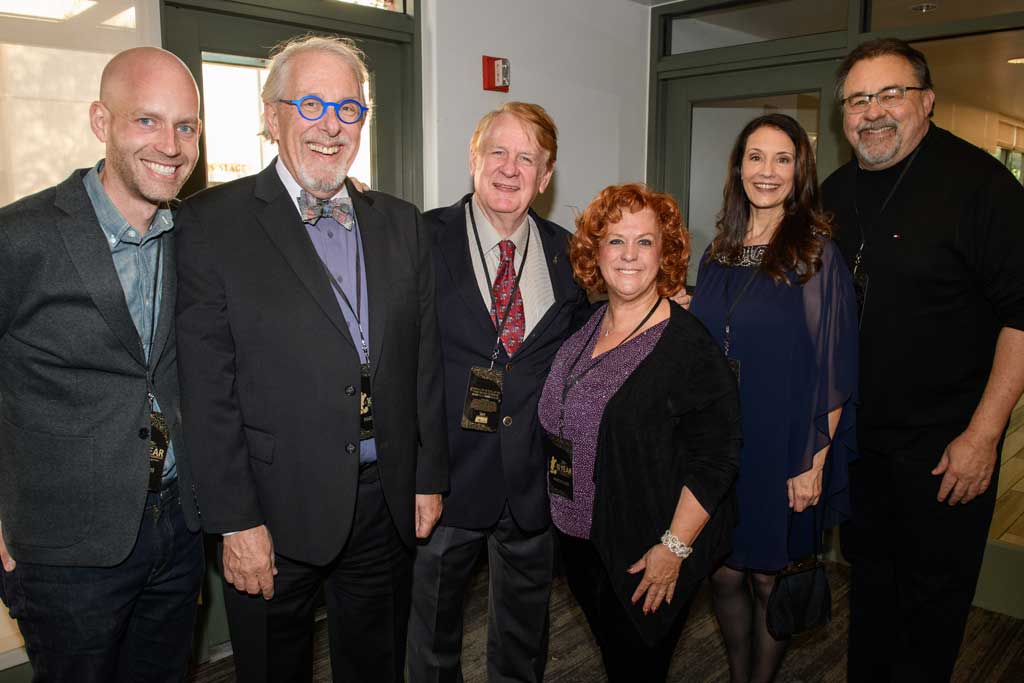 Left to right, Bret Iwan (voice of Mickey Mouse), Bill Rogers (voice actor, announcer at Disneyland), Bill Farmer (voice of Goofy), producer Jennifer Farmer, Camille Dixon (voice actor, announcer at Disney California Adventure), and producer Don Hahn at D23’s 10-Year FAN-niversary Celebration at the Walt Disney Studios, March 10, 2019.