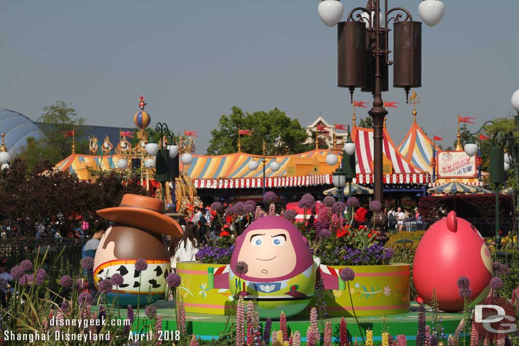 The Toy Story foursome of Woody, Buzz, Jessie and Lotso in the center of the Gardens of Imagination
