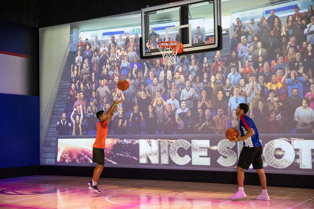 Guests at NBA Experience can test their skills at Shoot! where they step onto the court and hear the roar of the crowd while maneuvering through a series of last-second shots before the clock expires. NBA Experience immerses guests of all ages and skills into the world of professional basketball as both a fan and player at Disney Springs at Walt Disney World Resort in Lake Buena Vista, Fla. (Steven Diaz, photographer)