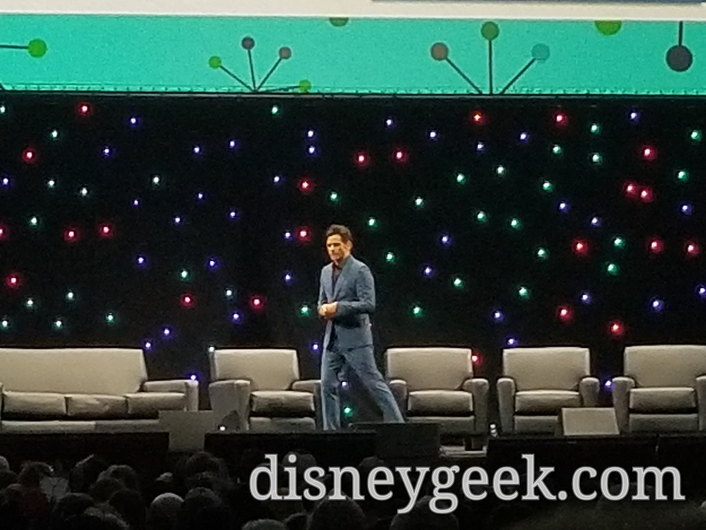 John Stamos takes the stage. He was the moderator for the panel.