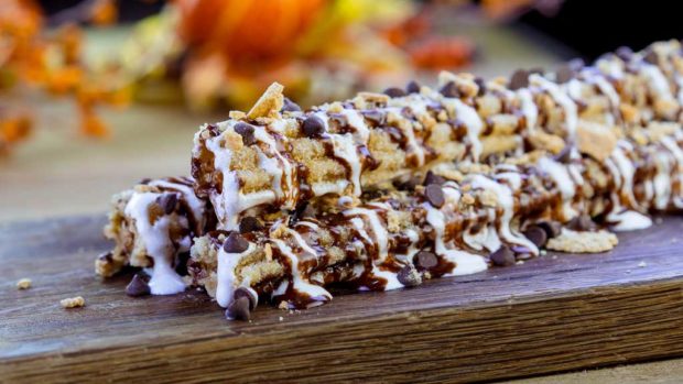 At the churro cart near Redwood Creek Challenge Trail at Disney California Adventure Park, guests will find this S’mores Churro rolled in graham cracker crumbs and topped with chocolate chips and a marshmallow drizzle. (David Nguyen/Disneyland Resort)