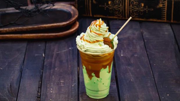 Disney guests will discover a variety of delicious treats during Halloween Time at Disneyland Resort, from Sept. 6 through Oct. 31, 2019. At Schmoozies! at Disney California Adventure Park, guests will find this caramel apple smoothie made with real apples, ice cream, caramel sauce and caramel apple lollipop. (David Nguyen/Disneyland Resort)