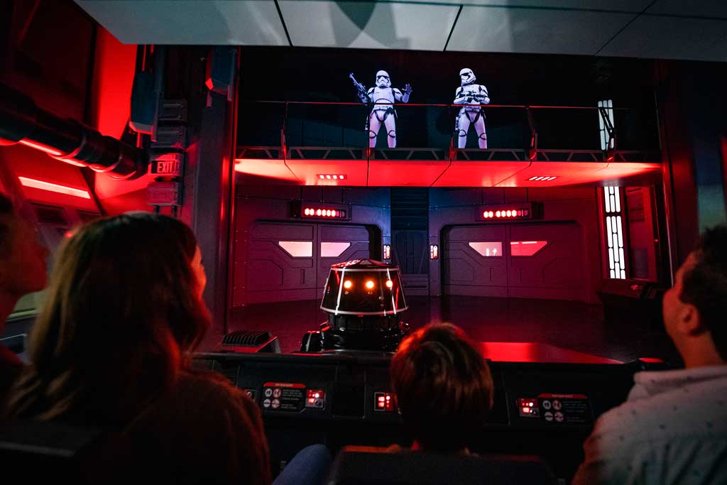 Guests flee First Order Stormtroopers onboard a Star Destroyer as part of Star Wars: Rise of the Resistance, the groundbreaking new attraction opening Dec. 5, 2019, inside Star Wars: Galaxy’s Edge at Disney’s Hollywood Studios in Florida and Jan. 17, 2020, at Disneyland Park in California. (Matt Stroshane, photographer)