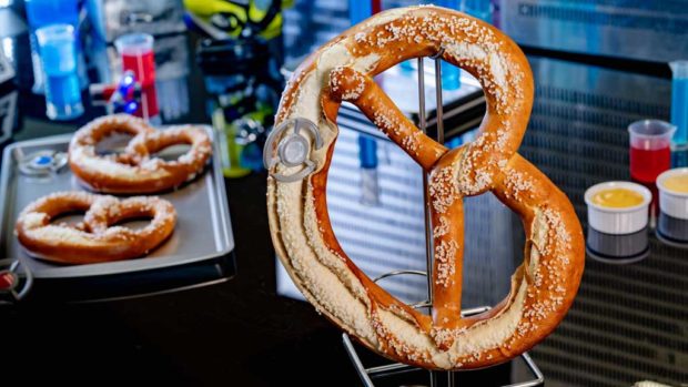 Experiment No. IP42: Quantum Pretzel features a pretzel that has been enlarged by a quantum tunnel and comes with mustard and beer cheese dipping sauce. (David Nguyen/Disneyland Resort)