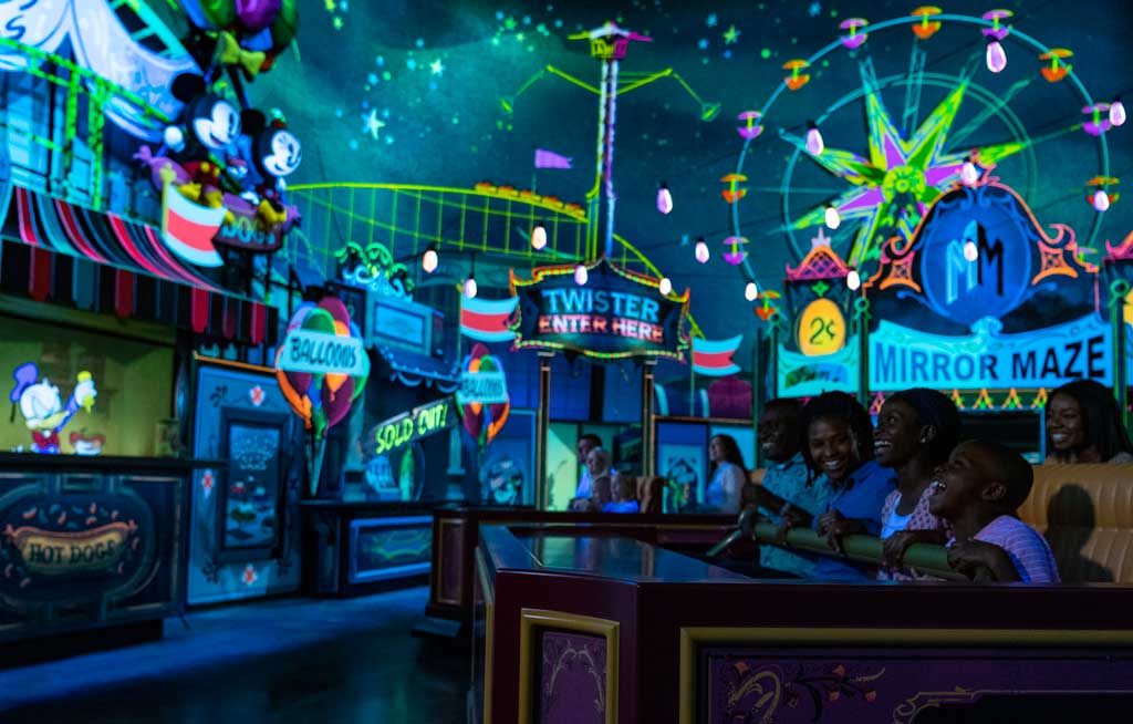 Guests visit an action-packed carnival as part of their journey aboard Mickey & Minnie’s Runaway Railway, opening March 4, 2020, in Disney’s Hollywood Studios at Walt Disney World Resort in Lake Buena Vista, Fla. The first ride-through attraction in Disney history featuring Mickey Mouse and Minnie Mouse brings guests into the vibrant world of “Mickey Mouse” cartoon shorts. (Matt Stroshane, photographer)