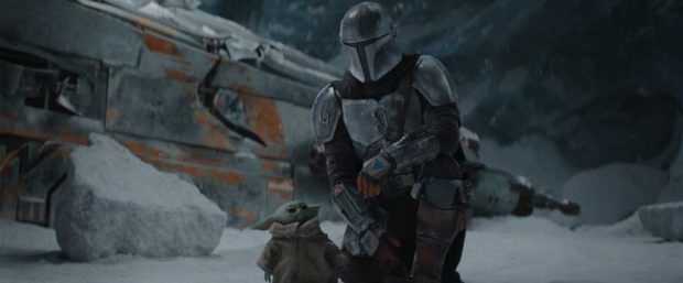 The Mandalorian (Pedro Pascal) and the Child in THE MANDALORIAN, season two. © 2020 Lucasfilm Ltd. & TM. All Rights Reserved.