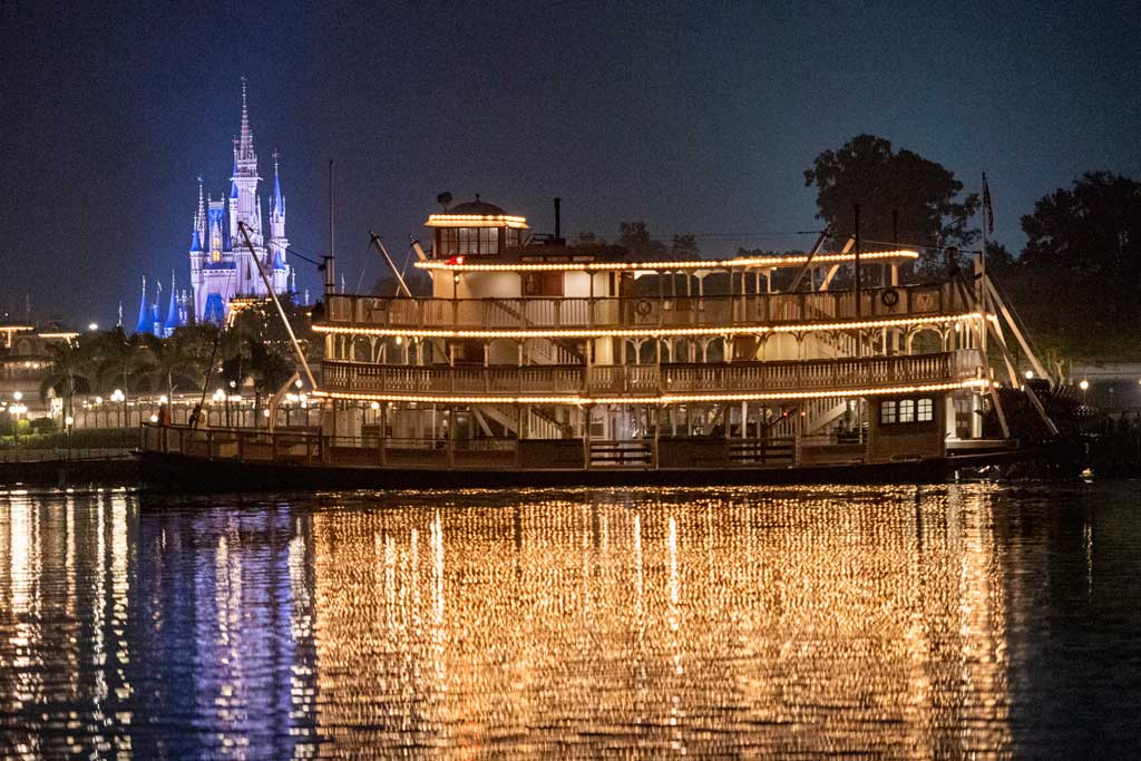 The Liberty Belle riverboat crosses in front of Magic Kingdom Park during an overnight repositioning following a nearly complete scheduled refurbishment at Walt Disney World Resort in Lake Buena Vista, Fla. It was a rare sight to behold, as crews towed the 47-foot-tall classic steam ship back to her home in Liberty Square. (David Roark, photographer)