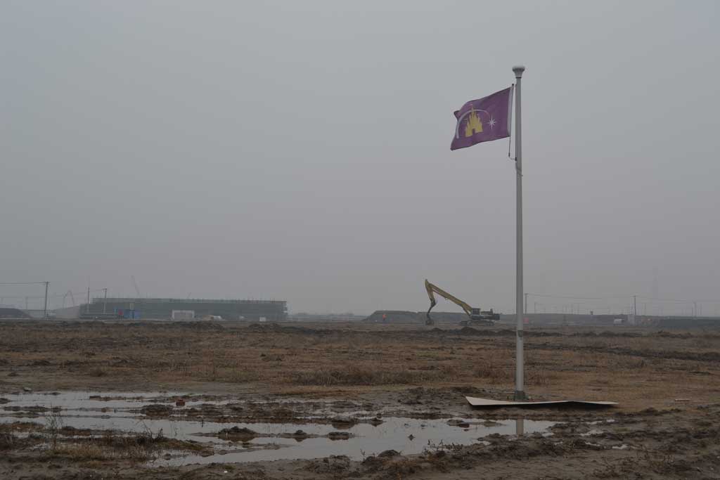 A flag standing on the construction site, indicating where the world’s tallest and largest Disney Castle – Enchanted Storybook Castle – would eventually stand. The