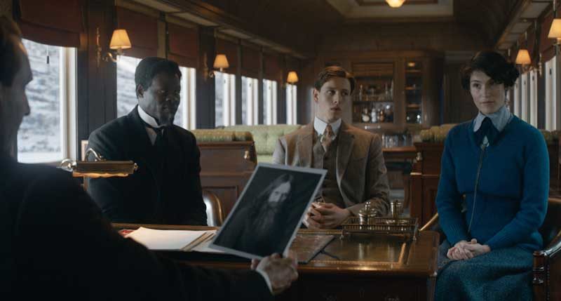 Ralph Fiennes as Oxford, Djimon Hounsou as Shola, Harris Dickinson as Conrad and Gemma Arterton as Polly in 20th Century Studios’ THE KING’S MAN. Photo Credit: Courtesy of 20th Century Studios. © 2020 Twentieth Century Fox Film Corporation. All Rights Reserved.