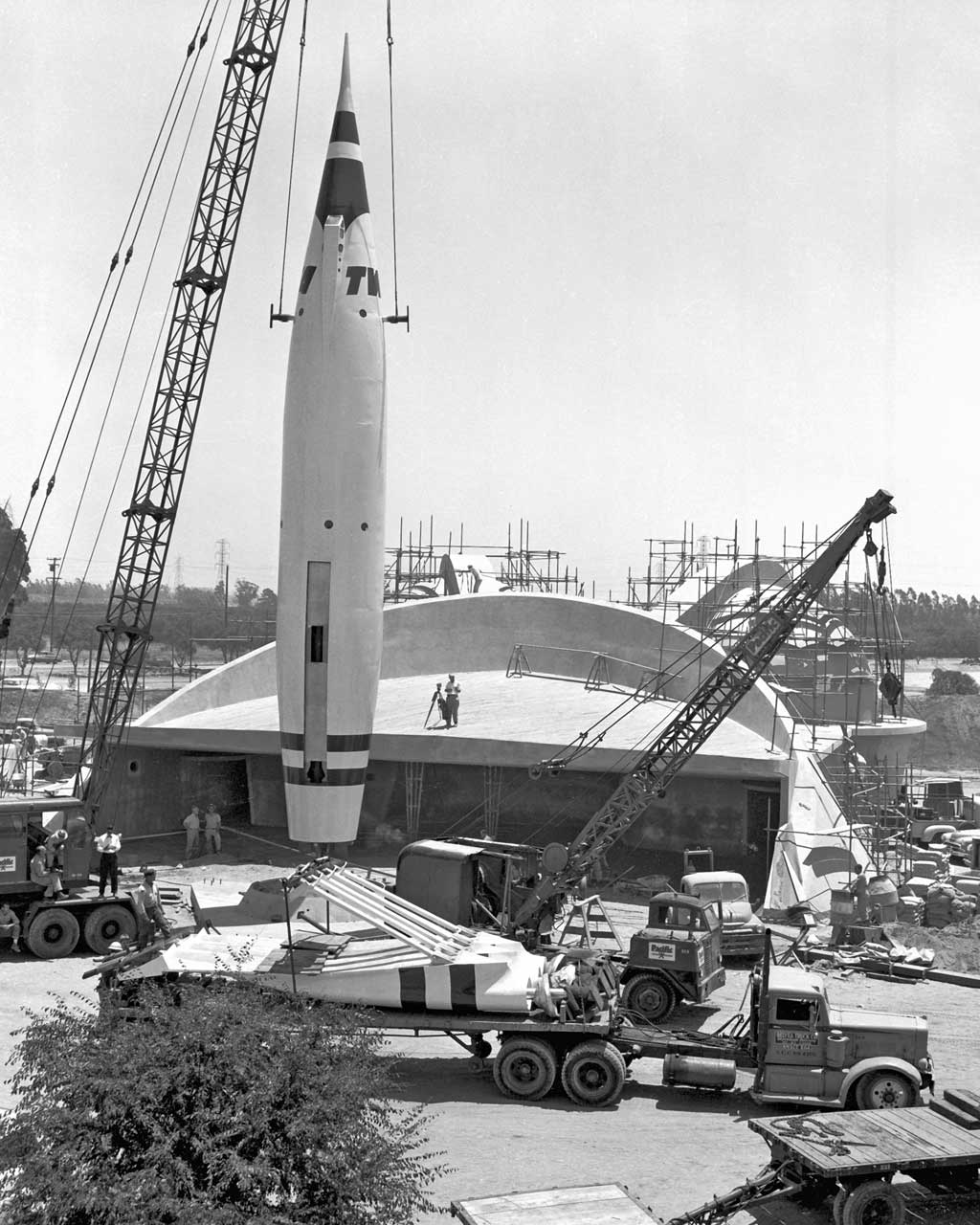 TOMORROWLAND UNDER CONSTRUCTION (1955) -Ð Only days before opening day, a crane lifts the ÒRocket to the MoonÓ during construction of Tomorrowland.