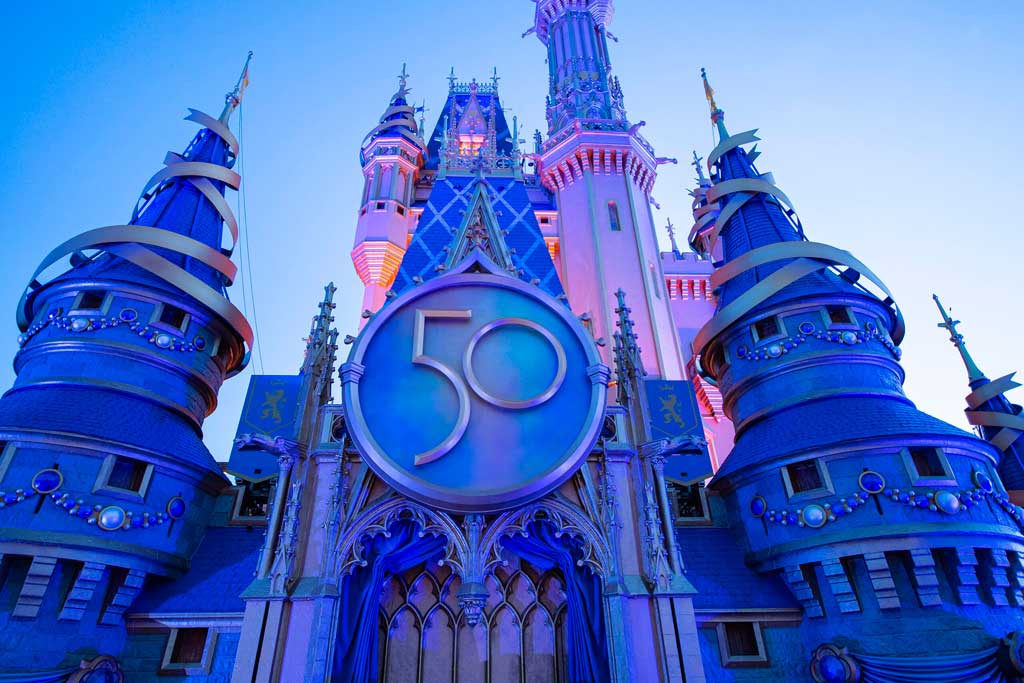 A new crest honoring the 50th anniversary of Walt Disney World Resort adorns Cinderella Castle at Magic Kingdom Park in Lake Buena Vista, Fla. The crest completes the castle’s royal, EARidescent makeover, joining gold bunting, sparkling embellishments and other new enhancements leading up to “The World’s Most Magical Celebration” beginning Oct. 1, 2021. (Kent Phillips, photographer)