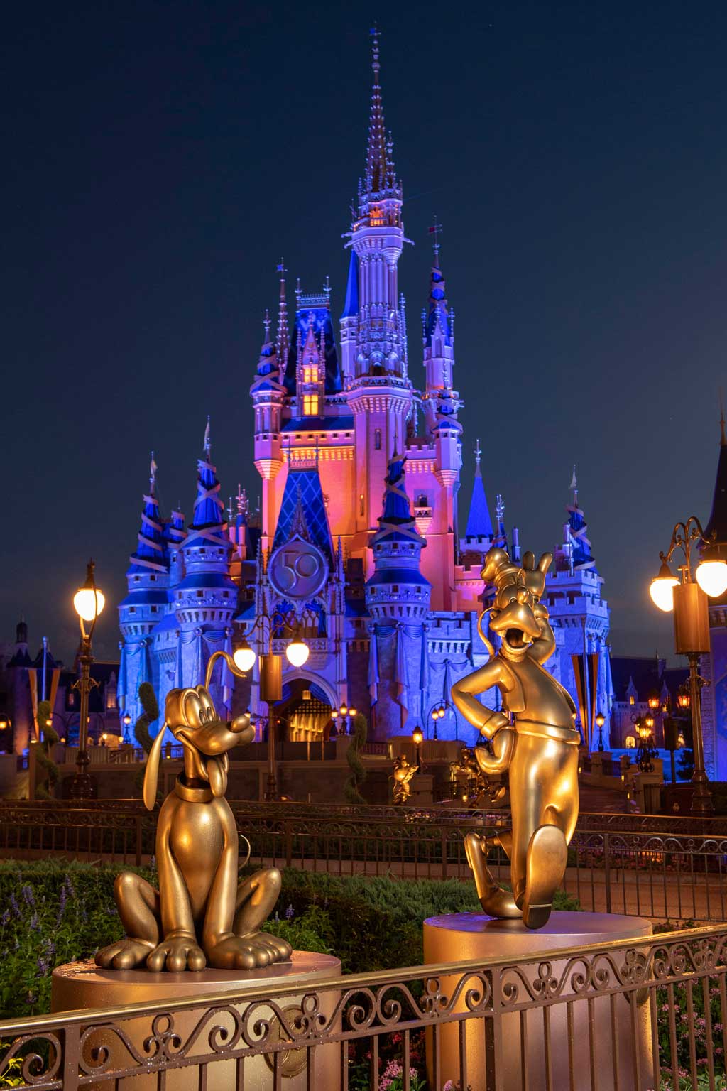 Pluto and Goofy at Magic Kingdom Park are two of the “Disney Fab 50” golden character sculptures appearing in all four Walt Disney World Resort theme parks in Lake Buena Vista, Fla., as part of “The World’s Most Magical Celebration,” beginning Oct. 1, 2021, in honor of the resort’s 50th anniversary. (David Roark, photographer)