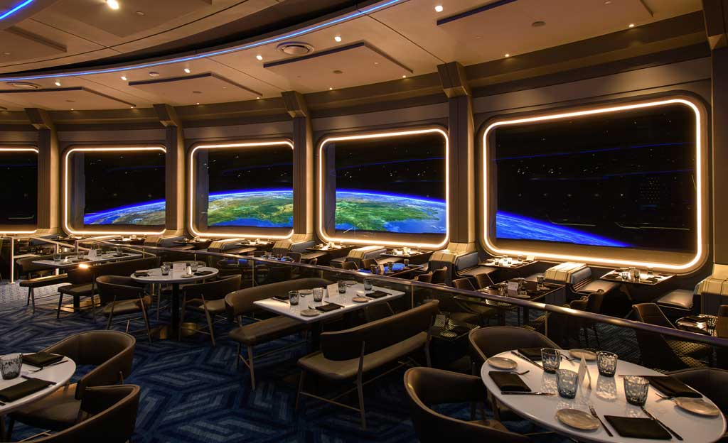 Space 220 Restaurant offers the “height of dining” at EPCOT at Walt Disney World Resort in Lake Buena Vista, Fla. The first-of-its-kind concept opens Sept. 27, 2021, inviting guests to feel as if they travel 220 miles above Earth to the Centauri Space Station for lunch or dinner. (Todd Anderson, photographer)