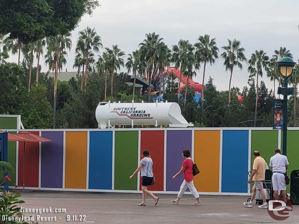 A water tank is visible over the wall from Downtown Disney