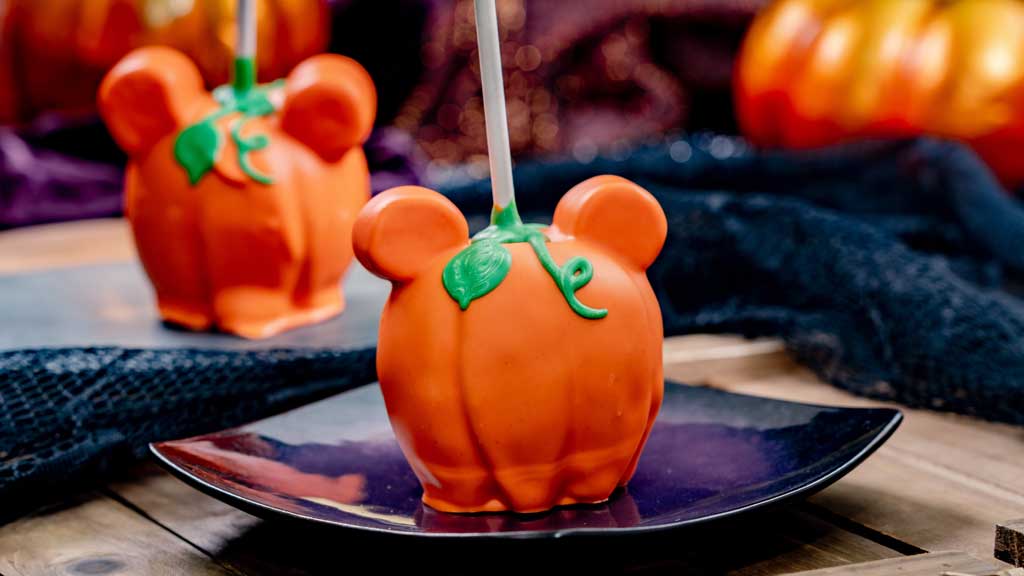 Mickey Pumpkin Apple (Candy Palace, Pooh Corner at Disneyland Park and Bing Bongs and Trolley Treats at Disney California Adventure Park) - Green Granny Smith apple dipped in caramel with marshmallow ears enrobed in orange-white chocolate and green, white chocolate leaf. For more details, visit DisneyParksBlog.com. (David Nguyen/Disneyland Resort) 