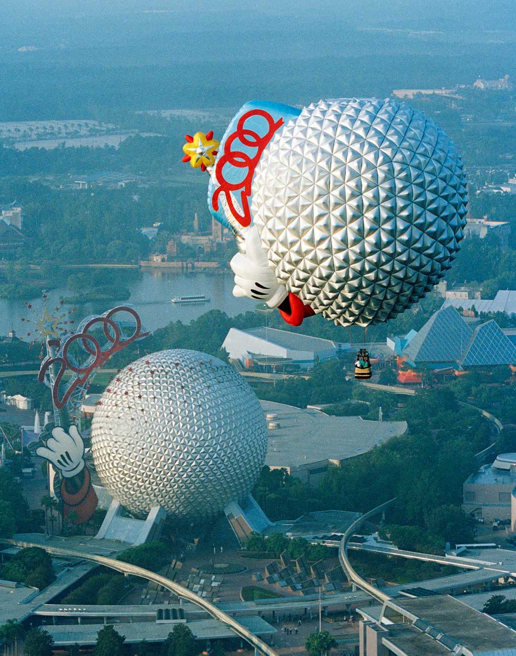 A celebratory hot air balloon shaped like Spaceship Earth flies over EPCOT in 2000 at Walt Disney World Resort in Lake Buena Vista, Fla. (Alain Boniec, Photographer)
