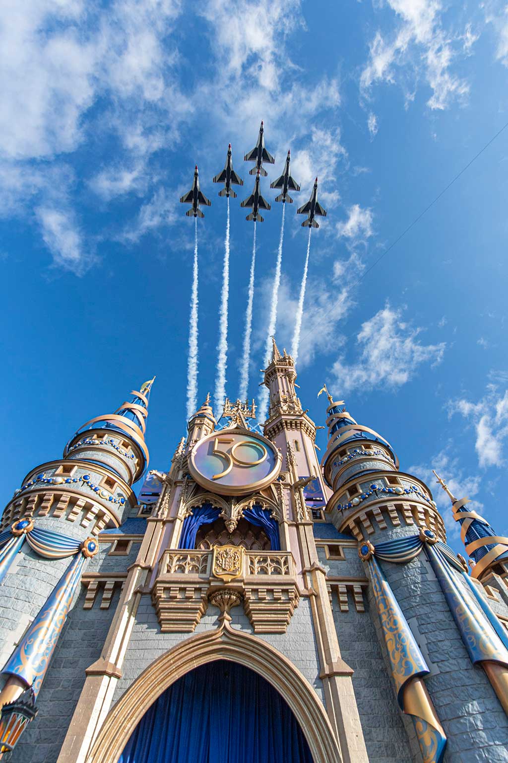  U.S. Air Force Thunderbirds fly over Cinderella Castle at Magic Kingdom Park at Walt Disney World Resort in Lake Buena Vista, Fla., Oct. 27, 2022, as a prelude to the beginning of National Veterans and Military Families Month in November. (Abigail Nilsson, Photographer) 