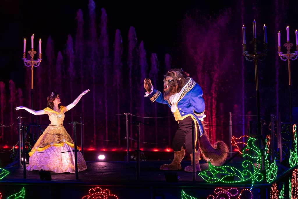 Belle and Beast float across the water as the air fills with love and romance