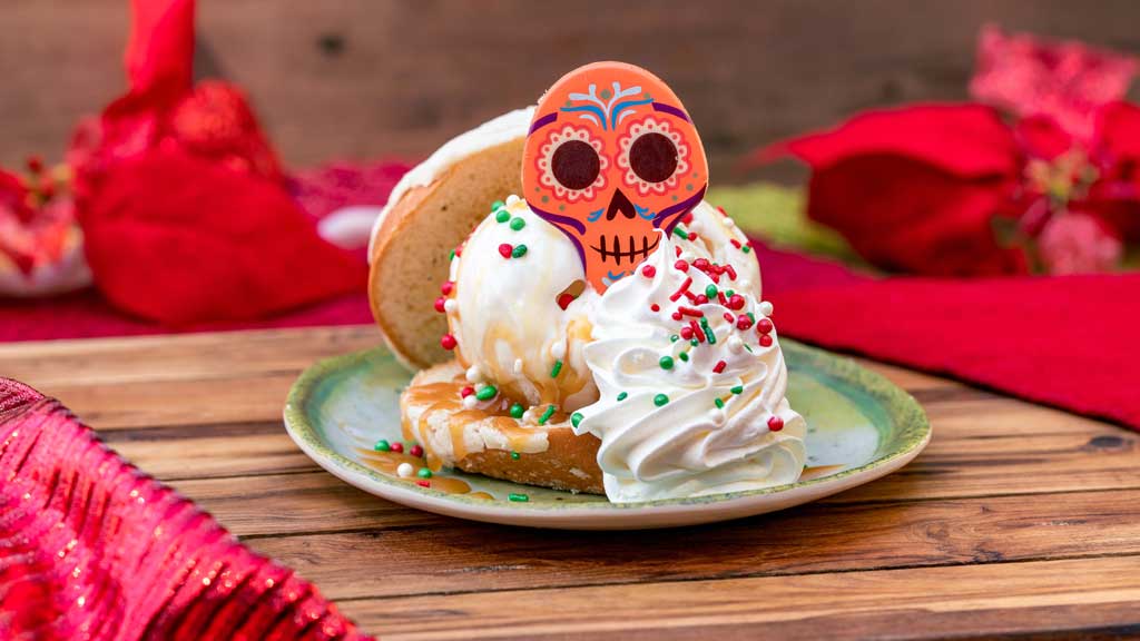 Pan Dulce Ice Cream Sandwich (Rancho del Zocalo at Disneyland Park in Anaheim, Calif.) - Colorful Mexican sweet bread with eggnog ice cream, hot buttered rum-flavored sauce, whipped topping and chocolate skull.