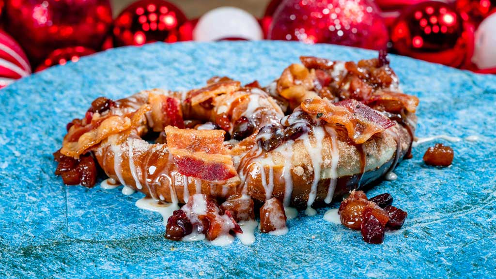 Atomic Pretzel: Apple-Bacon Soft Pretzel (Pym Test Kitchen at Disney California Adventure Park in Anaheim, Calif.) - Cinnamon-sugar salted pretzel with apple-bacon compote, cranberries, caramel sauce, cream cheese and candied pepper bacon.