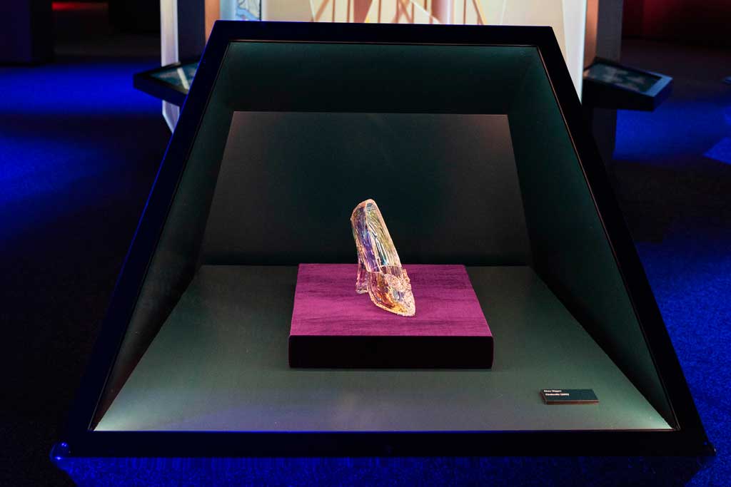 Glass slipper from the live-action Cinderella (2015) on display at Disney100: The Exhibition, now open at The Franklin Institute in Philadelphia. ©Disney
