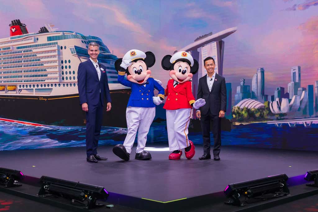 Disney Parks, Experiences and Products Chairman Josh D’Amaro and Singapore Tourism Board Chief Executive Keith Tan celebrate with Captain Mickey Mouse and Captain Minnie Mouse during a joint news conference in Singapore, Wednesday, March 29, 2023. Disney Cruise Line and Singapore Tourism Board announced magical cruise vacations to Southeast Asia for the first time, with plans to homeport a brand-new Disney cruise ship exclusively in Singapore for at least five years beginning in 2025. (Daryl Goh, photographer) 