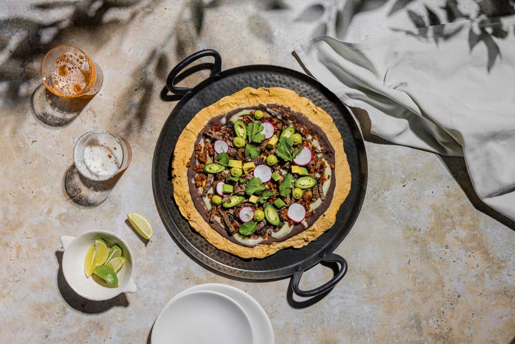Tlayuda (Céntrico at Downtown Disney District at Disneyland Resort in Anaheim, Calif.) – an Oaxacan shareable dish reminiscent of a pizza with a perfect crunch by Michelin-starred Chef Carlos Gaytán. (Courtesy Patina Restaurant Group)