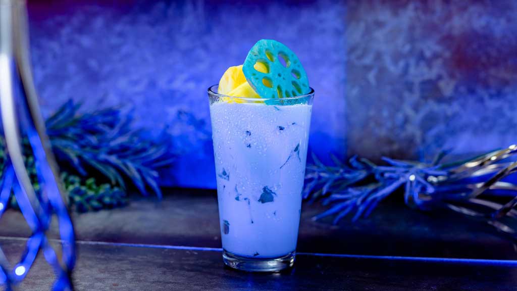 Pi-Co Punch: Pineapple juice, coconut milk and lime juice, garnished with pineapple chunks and lotus root (Non-alcoholic​). Available at Galactic Grill in Tomorrowland. (New) 